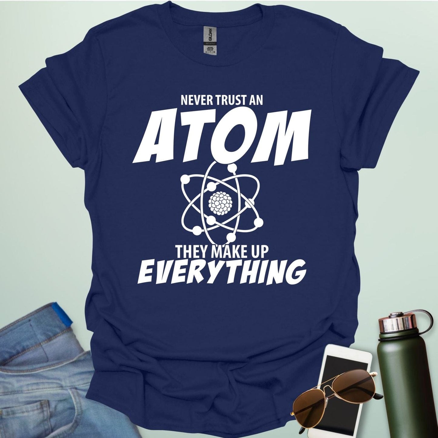 'Never Trust an Atom, They Make Up Everything' funny science t-shirt with atom graphic.