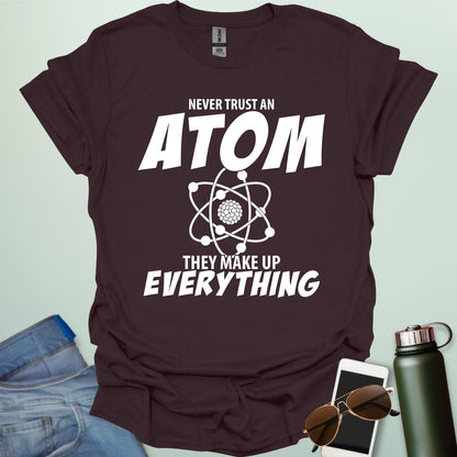 'Never Trust an Atom, They Make Up Everything' funny science t-shirt with atom graphic.