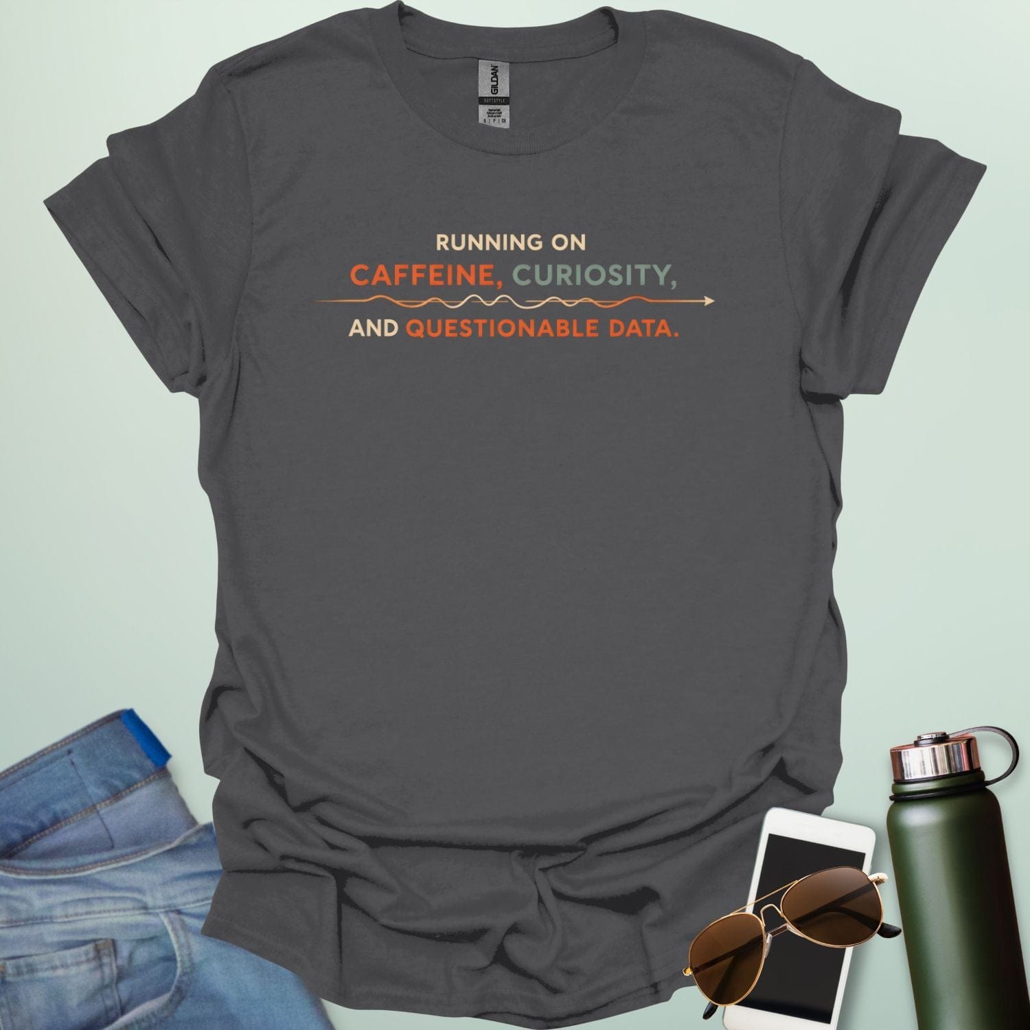 A graphic design featuring a coffee mug next to a messy line graph with the text "POWERED BY CAFFEINE AND QUESTIONABLE DATA."
