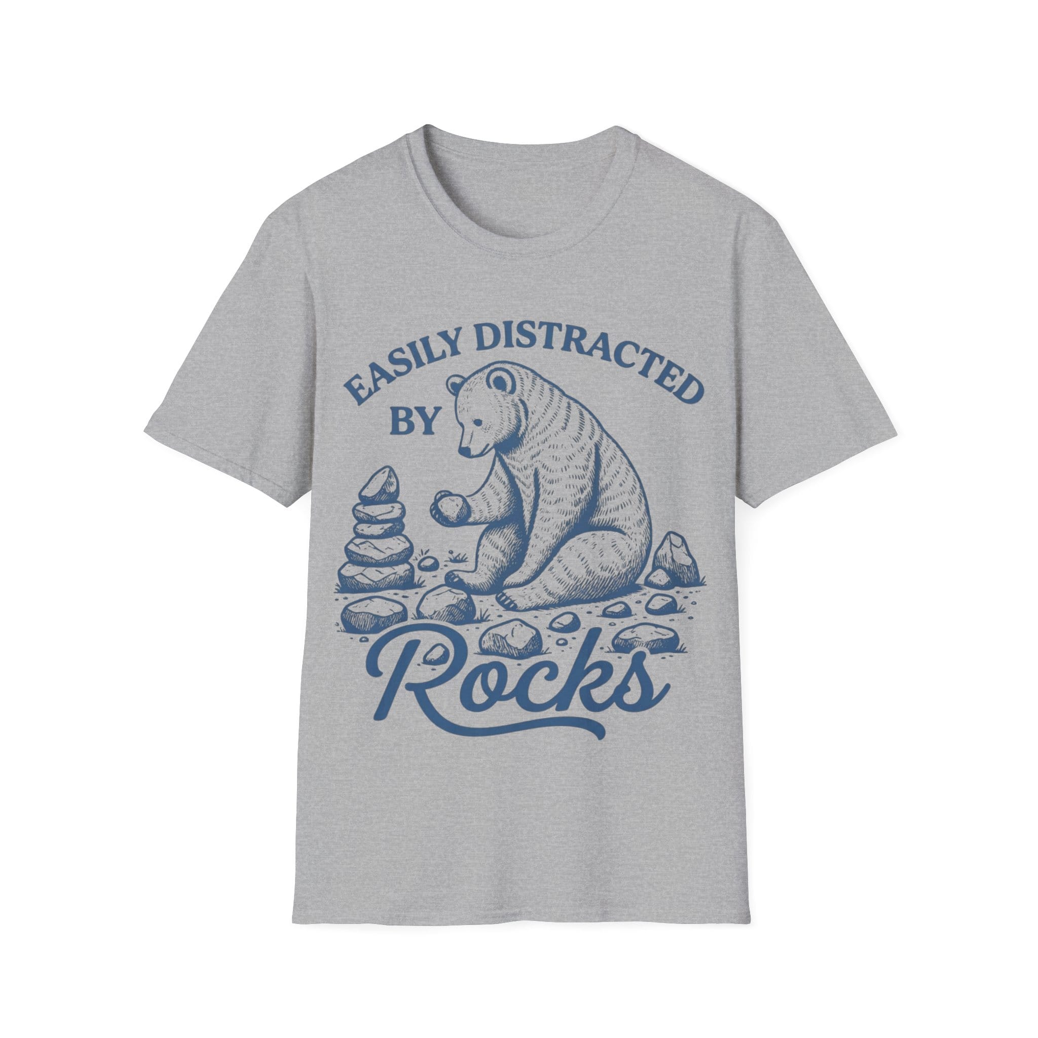 Linocut-style illustration of a bear sitting down examining a stone beside a cairn stack, framed by text reading 'EASILY DISTRACTED BY ROCKS'.