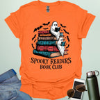 Spooky Readers Book Club t-shirt featuring ghosts reading books — a cozy Halloween design for book lovers and readers.
