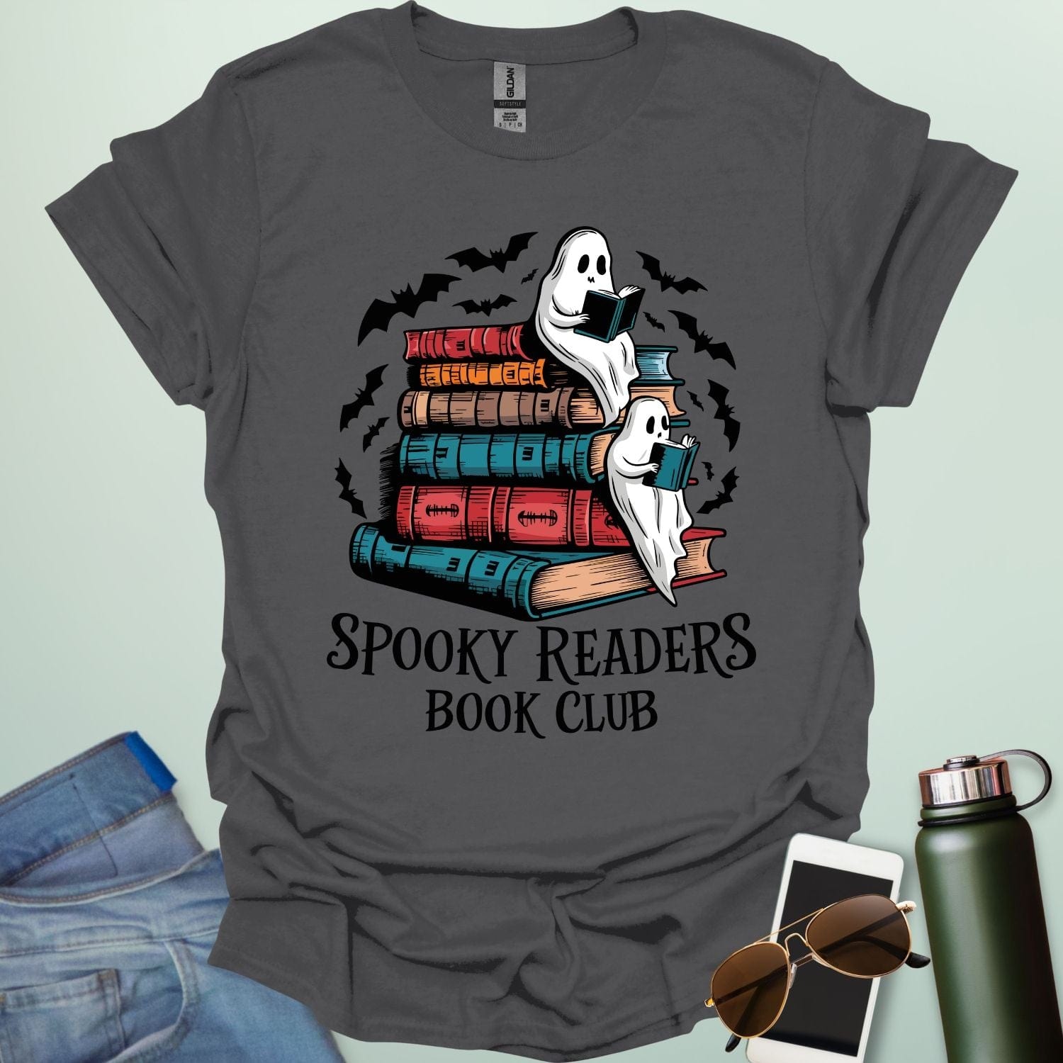 Spooky Readers Book Club t-shirt featuring ghosts reading books — a cozy Halloween design for book lovers and readers.
