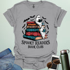 Spooky Readers Book Club t-shirt featuring ghosts reading books — a cozy Halloween design for book lovers and readers.