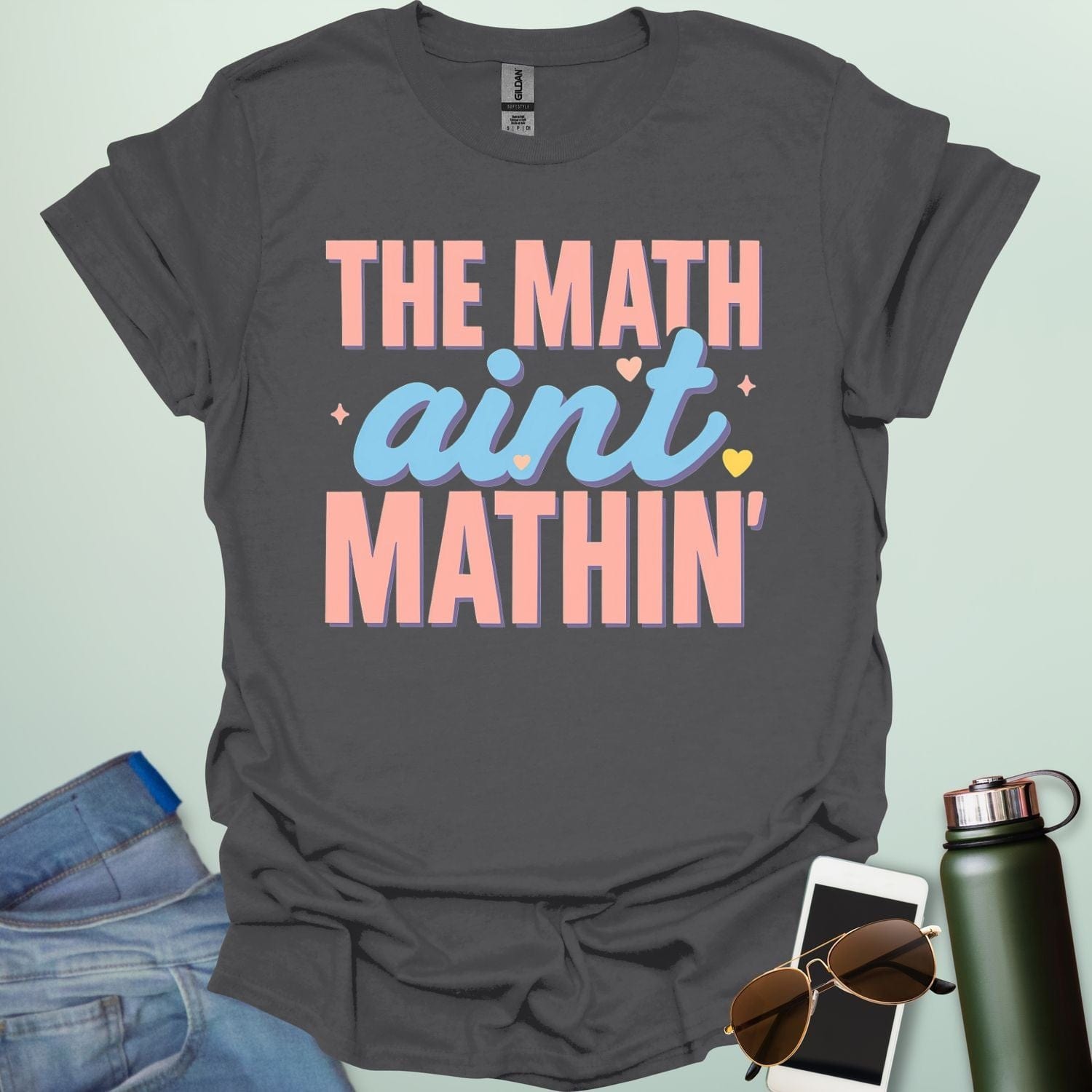 The Math Ain't Mathin'' t-shirt with stylized pink and blue lettering on a solid background.