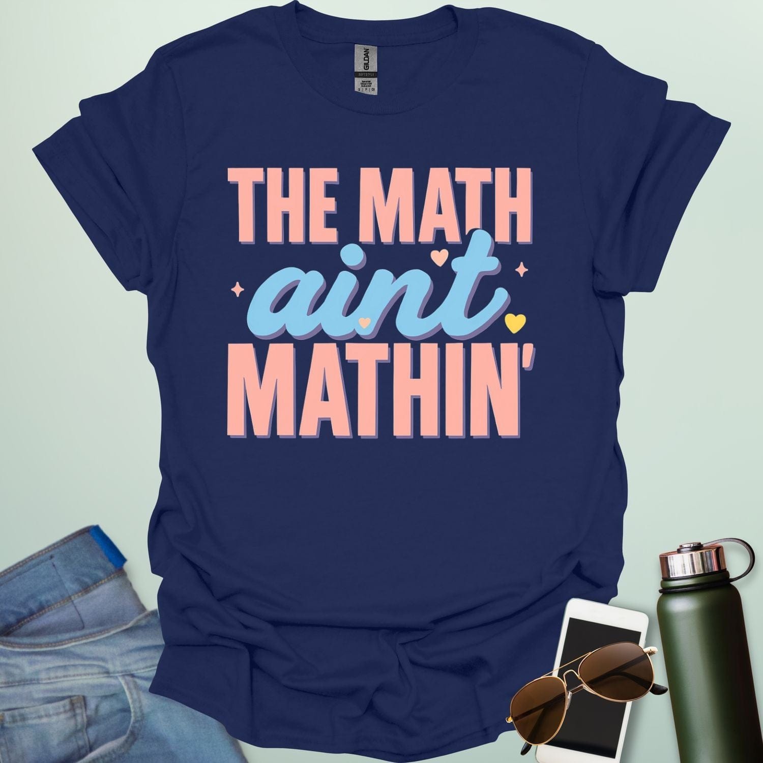 The Math Ain't Mathin'' t-shirt with stylized pink and blue lettering on a solid background.