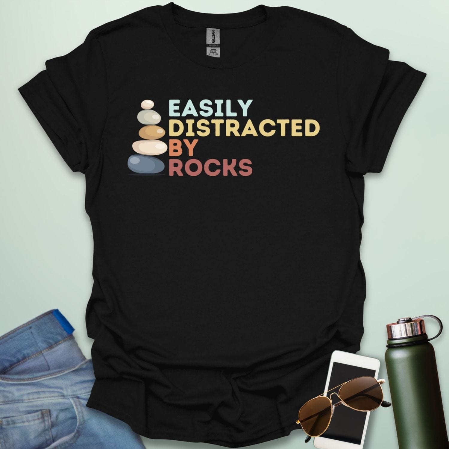 EASILY DISTRACTED BY ROCKS t-shirt with bold text design, funny geology shirt for rockhounds and earth science enthusiasts.