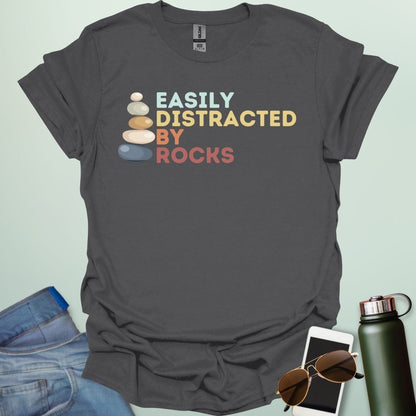 EASILY DISTRACTED BY ROCKS t-shirt with bold text design, funny geology shirt for rockhounds and earth science enthusiasts.