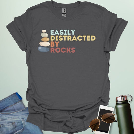 EASILY DISTRACTED BY ROCKS t-shirt with bold text design, funny geology shirt for rockhounds and earth science enthusiasts.