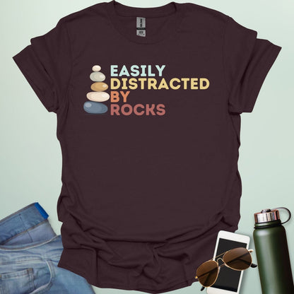 EASILY DISTRACTED BY ROCKS t-shirt with bold text design, funny geology shirt for rockhounds and earth science enthusiasts.