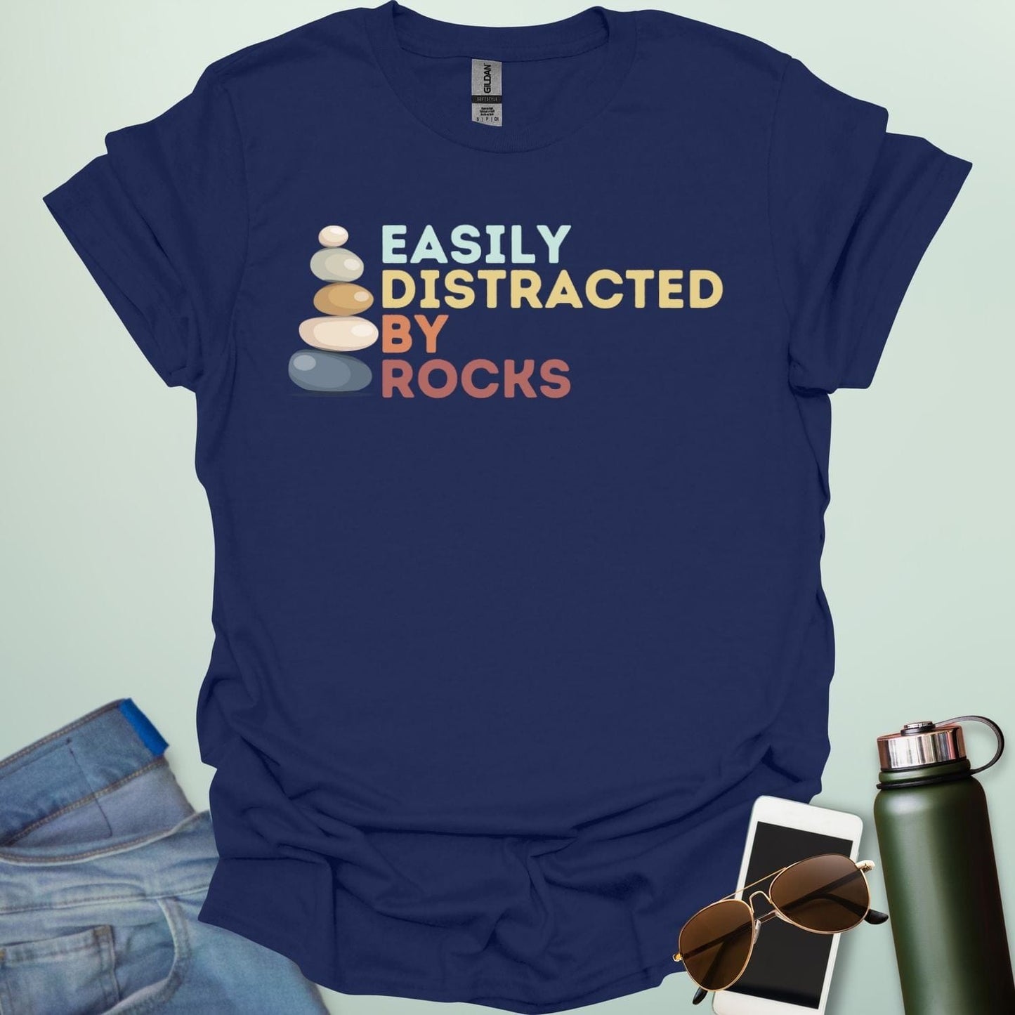 EASILY DISTRACTED BY ROCKS t-shirt with bold text design, funny geology shirt for rockhounds and earth science enthusiasts.
