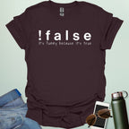 A dark chocolate shirt with the text '!false' in bold letters, with the tagline 'it's funny because it's true' in smaller letters below.