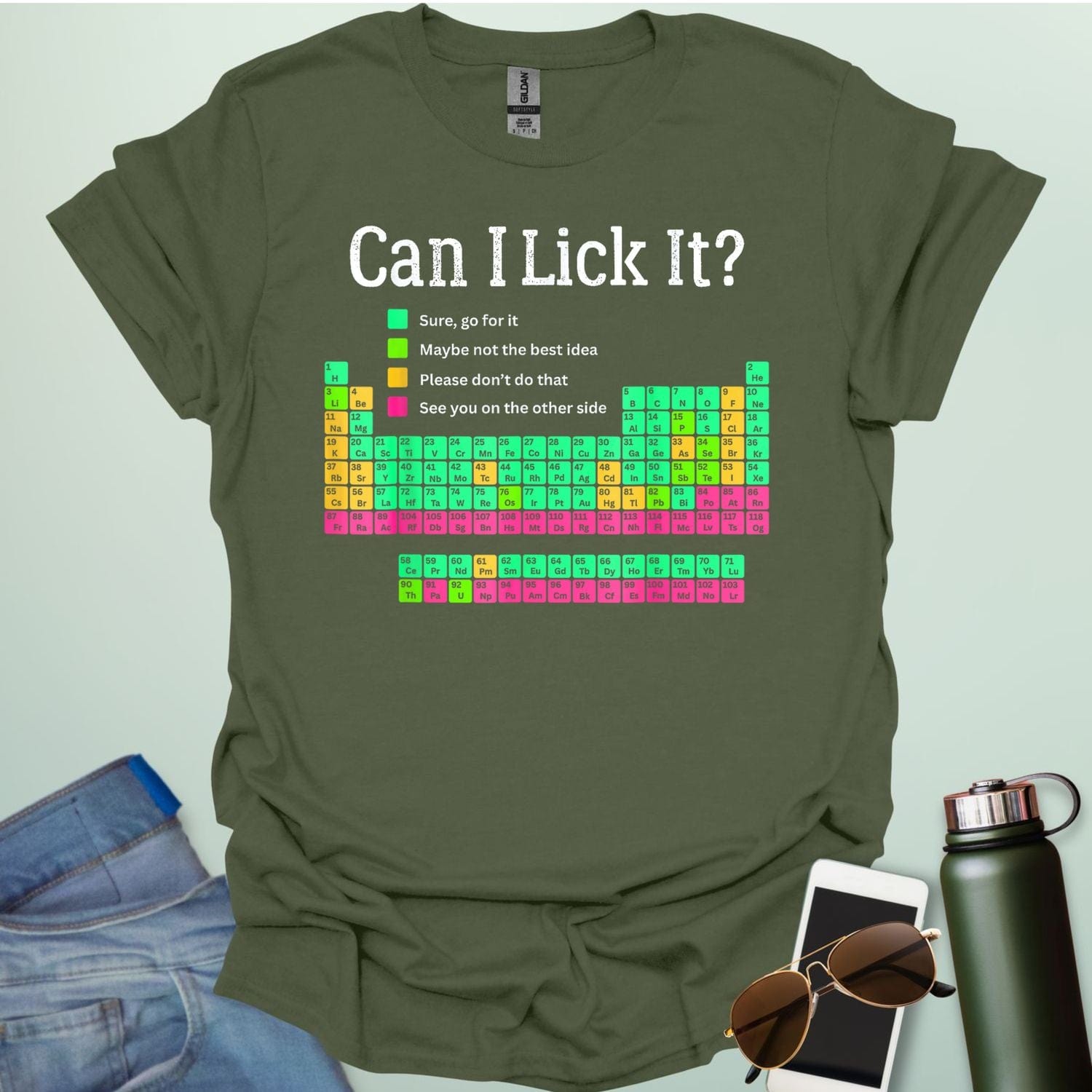 Can I Lick It?' periodic table t-shirt with a color-coded chart of elements and a funny chemistry warning.