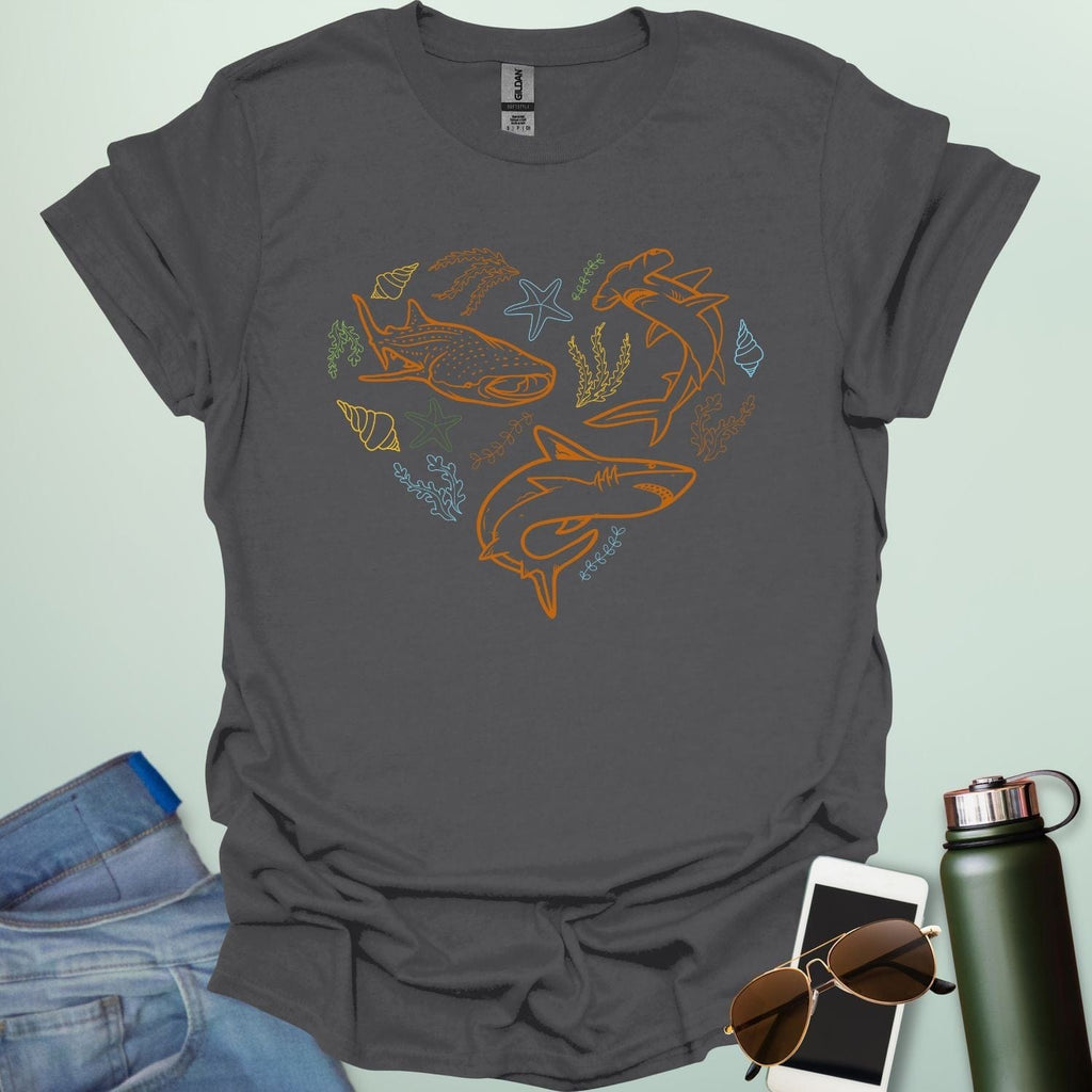 A collection of ocean animals, including sharks, sea stars, and seashells, arranged in a heart shape.