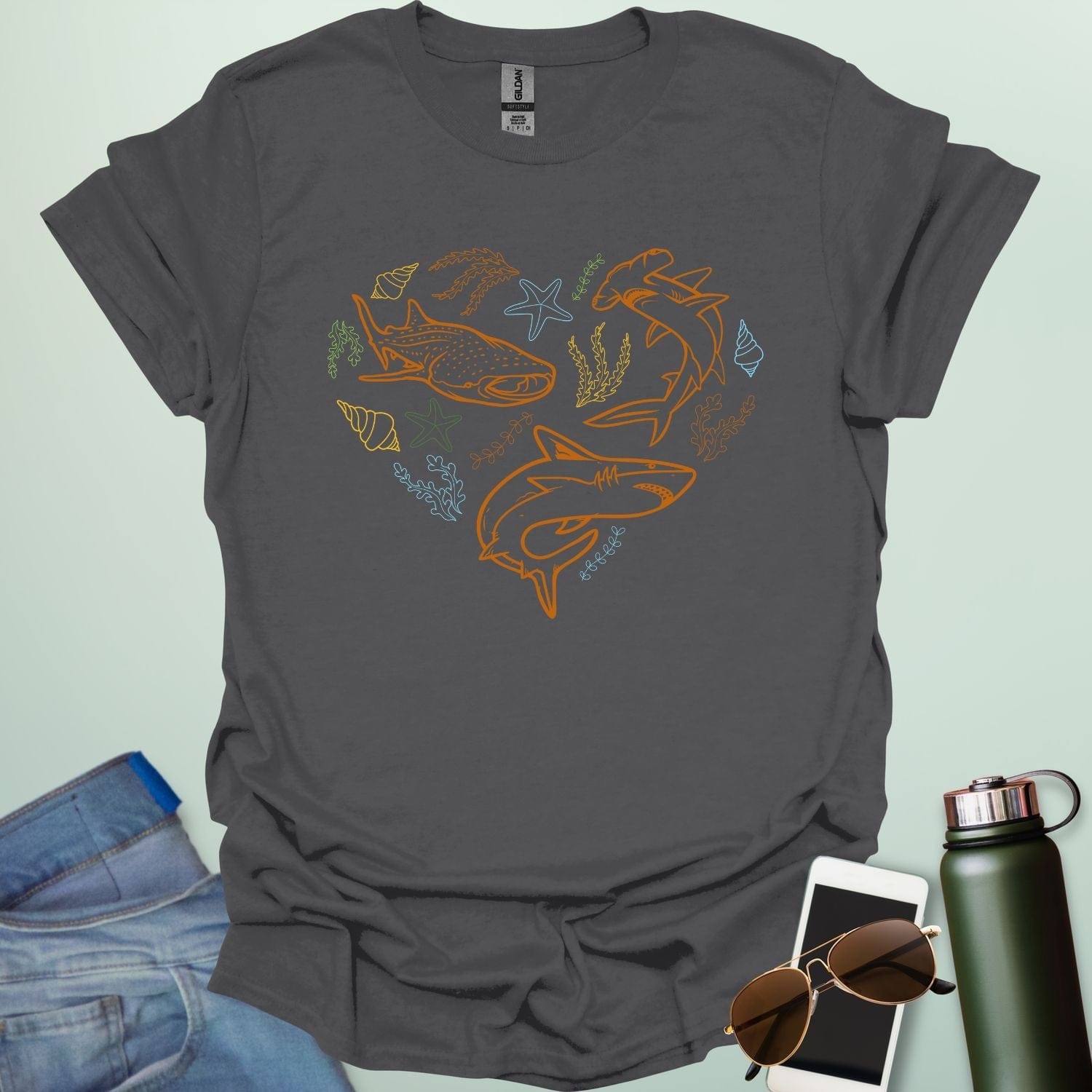 A collection of ocean animals, including sharks, sea stars, and seashells, arranged in a heart shape.