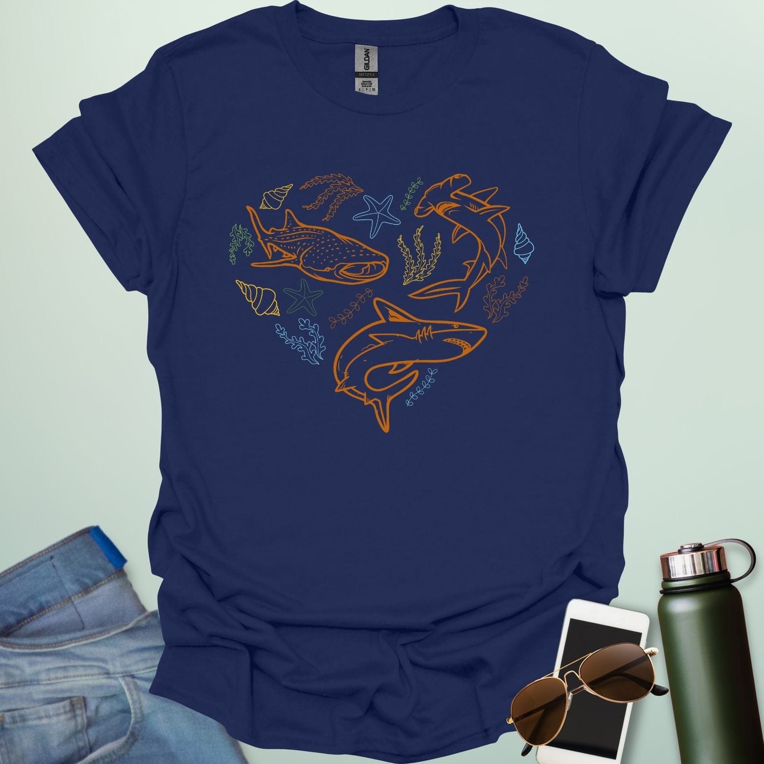A collection of ocean animals, including sharks, sea stars, and seashells, arranged in a heart shape.