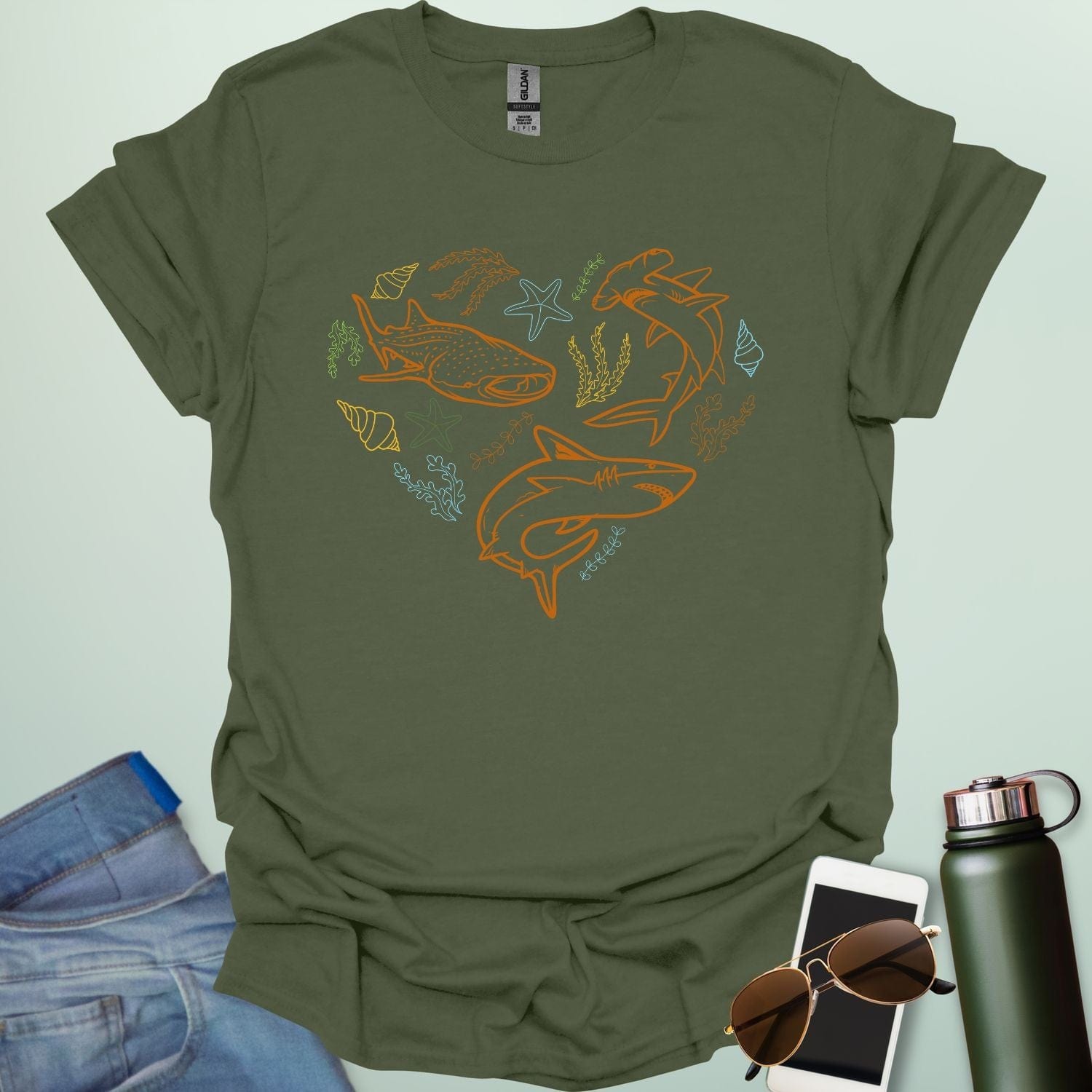 A collection of ocean animals, including sharks, sea stars, and seashells, arranged in a heart shape.
