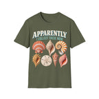 Vintage-style graphic featuring curved retro typography reading 'APPARENTLY I COLLECT THESE NOW' above detailed illustrations of colorful seashells, a nautilus shell, and a sand dollar.