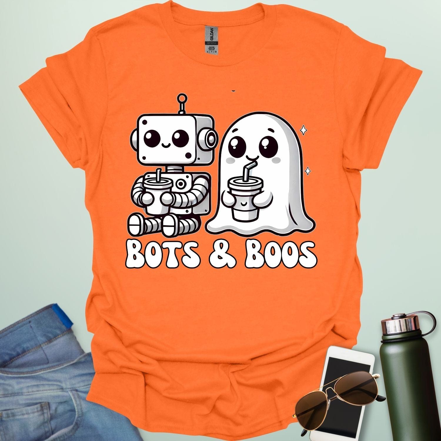 Bots & Boos t-shirt featuring robot/tech imagery with ghostly or spooky accents — a Halloween STEM-robotics design.