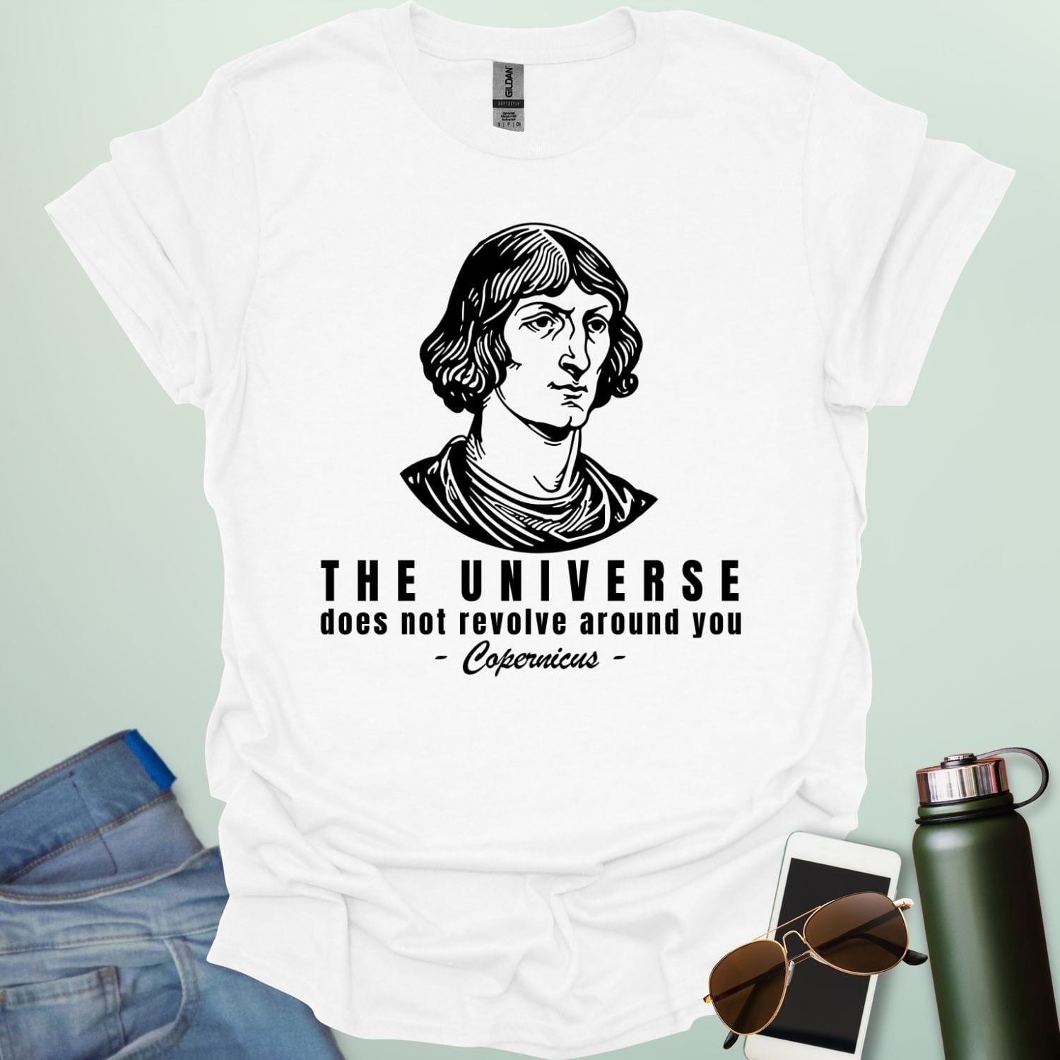 A white shirt with a sketch of Copernicus with the text 'The Universe Does Not Revolve Around You' in a bold font.