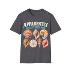 Vintage-style graphic featuring curved retro typography reading 'APPARENTLY I COLLECT THESE NOW' above detailed illustrations of colorful seashells, a nautilus shell, and a sand dollar.