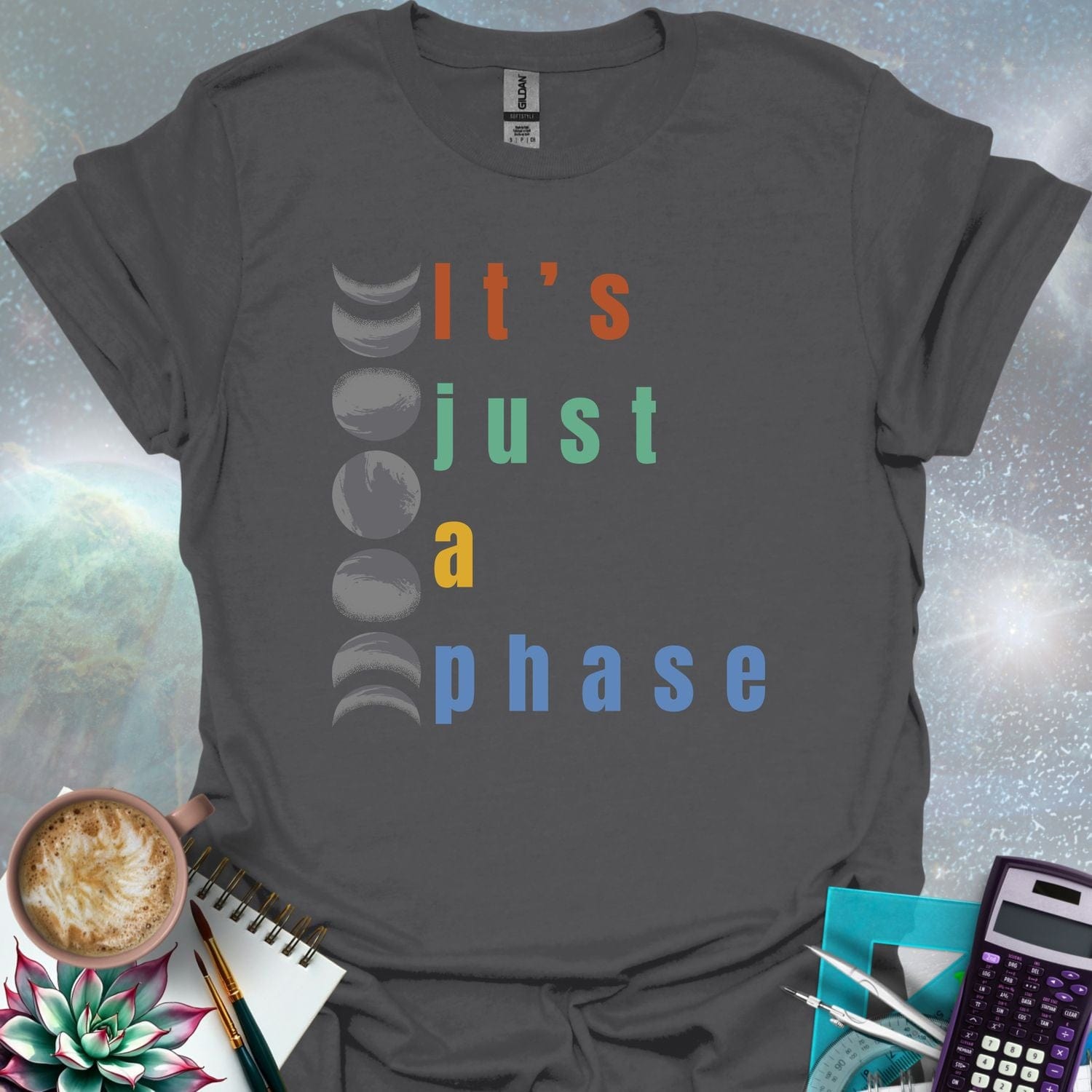 Vertical graphic of the eight moon phases with the text 'It's Just A Phase' in colorful stacked letters.