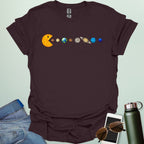A Pac-Man-like character eating the planets of the solar system, with the sun as its mouth.