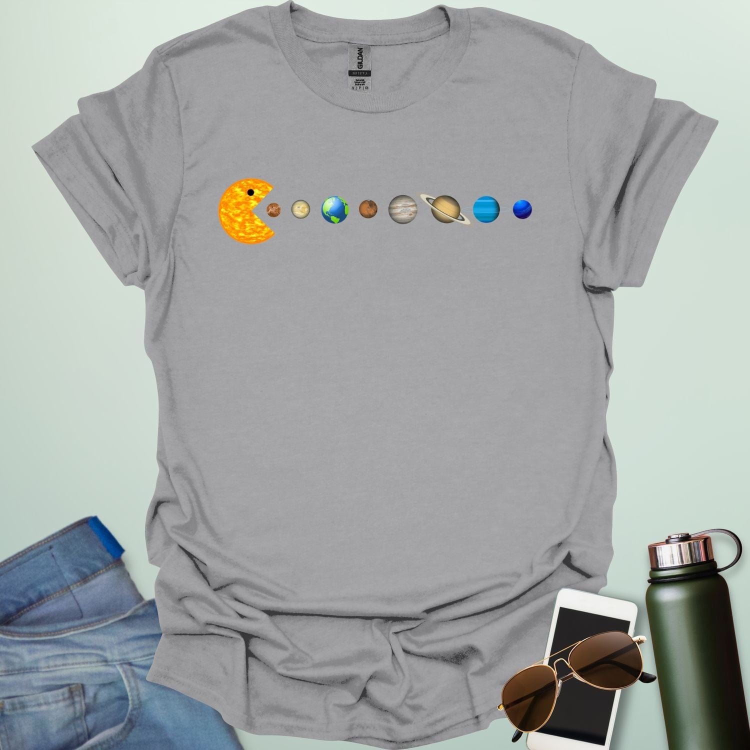 A Pac-Man-like character eating the planets of the solar system, with the sun as its mouth.