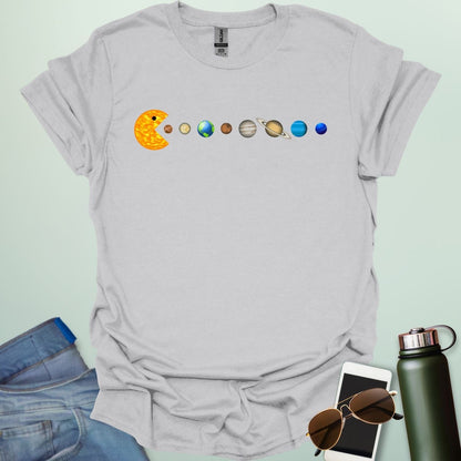 A Pac-Man-like character eating the planets of the solar system, with the sun as its mouth.