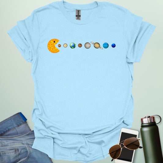 A Pac-Man-like character eating the planets of the solar system, with the sun as its mouth.