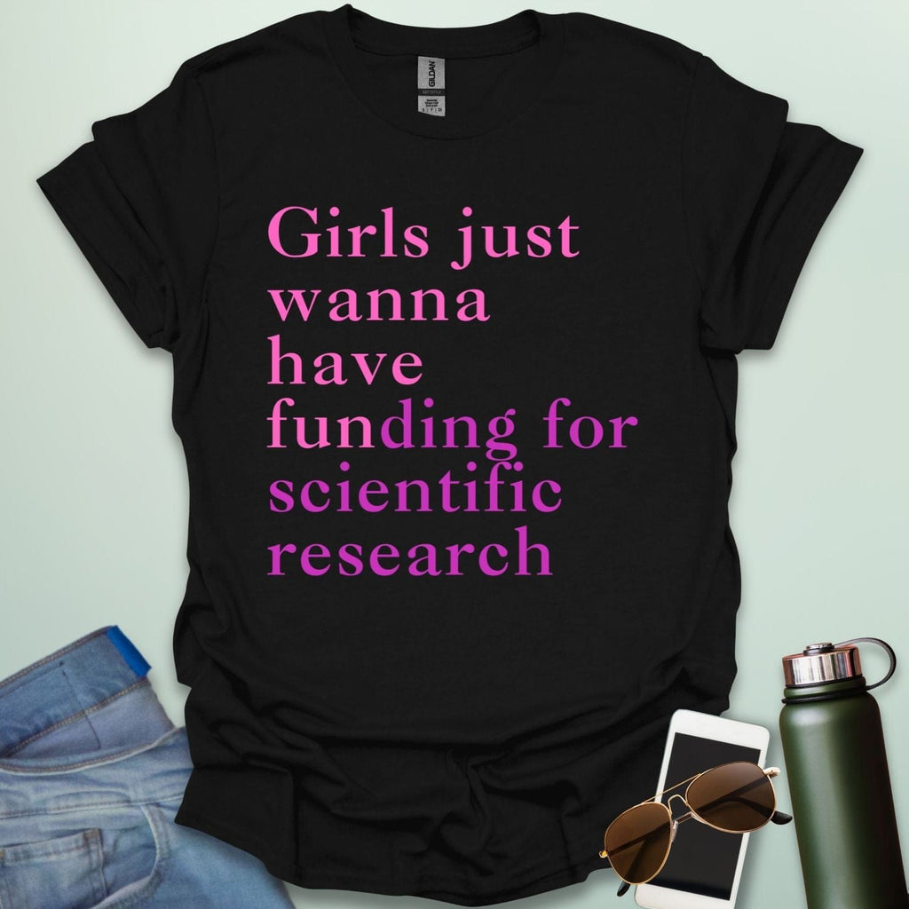 A black t-shirt with the text 'Girls just wanna have funding for scientific research' in a pink serif font.