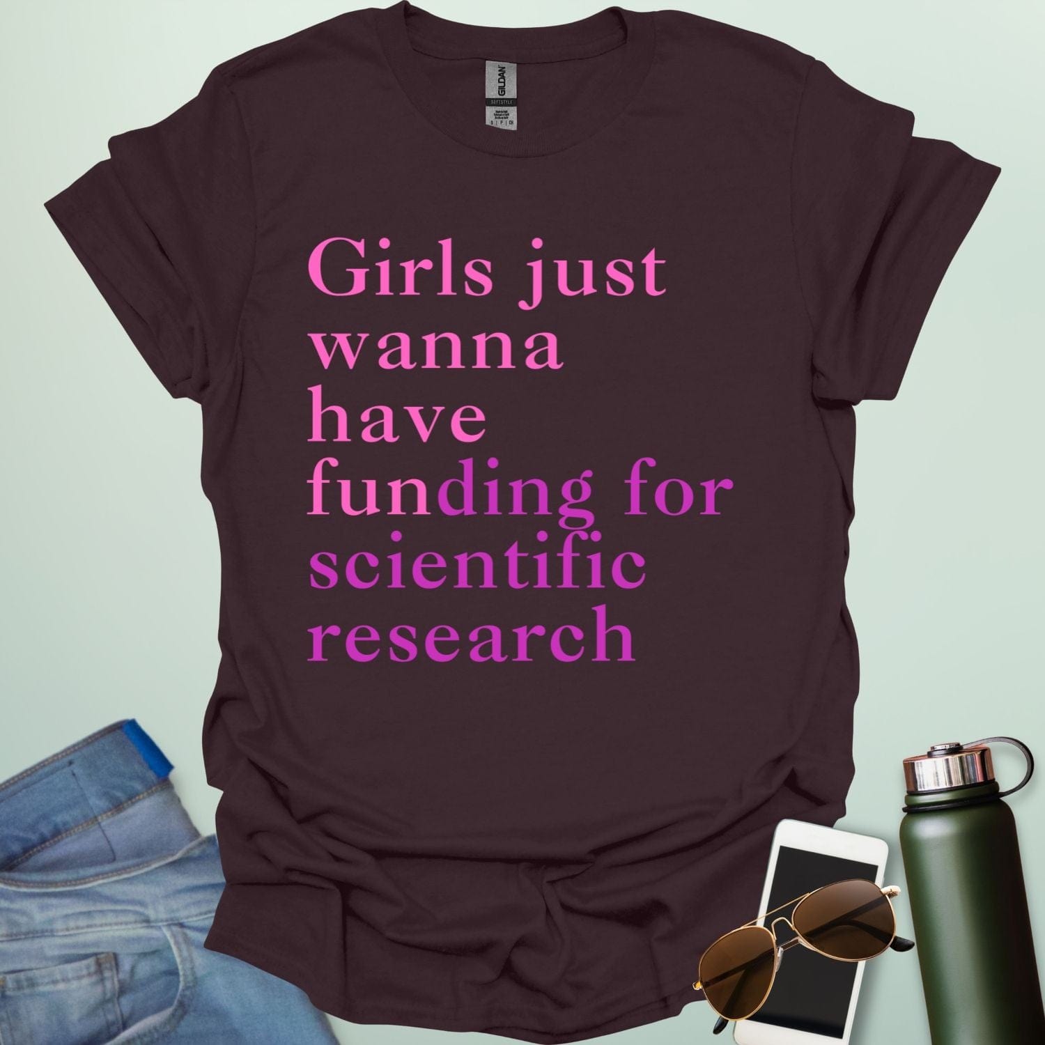 A dark chocolate t-shirt with the text 'Girls just wanna have funding for scientific research' in a pink serif font.