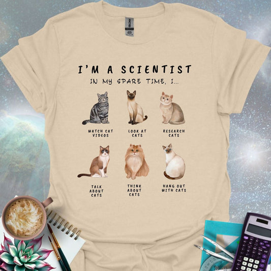T-shirt design featuring six cat illustrations with the text 'I'm a Scientist - In My Spare Time, I...' and various cat-related activities.