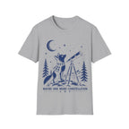 Vintage illustration of a fox wearing a plaid scarf gazing into a brass telescope framed by pine trees, a crescent moon, and text reading 'MAYBE ONE MORE CONSTELLATION'.