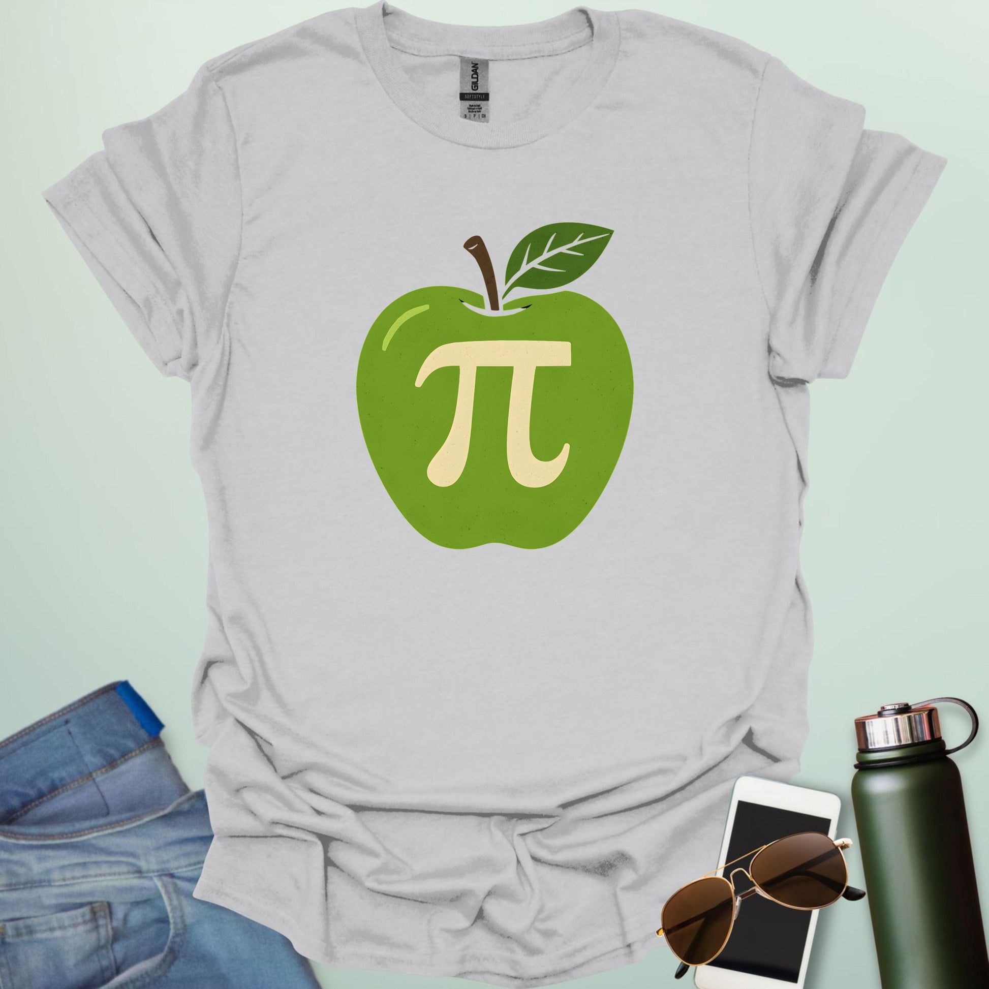 Apple Pi' t-shirt with a green apple graphic and a beige-colored Pi symbol inside.
