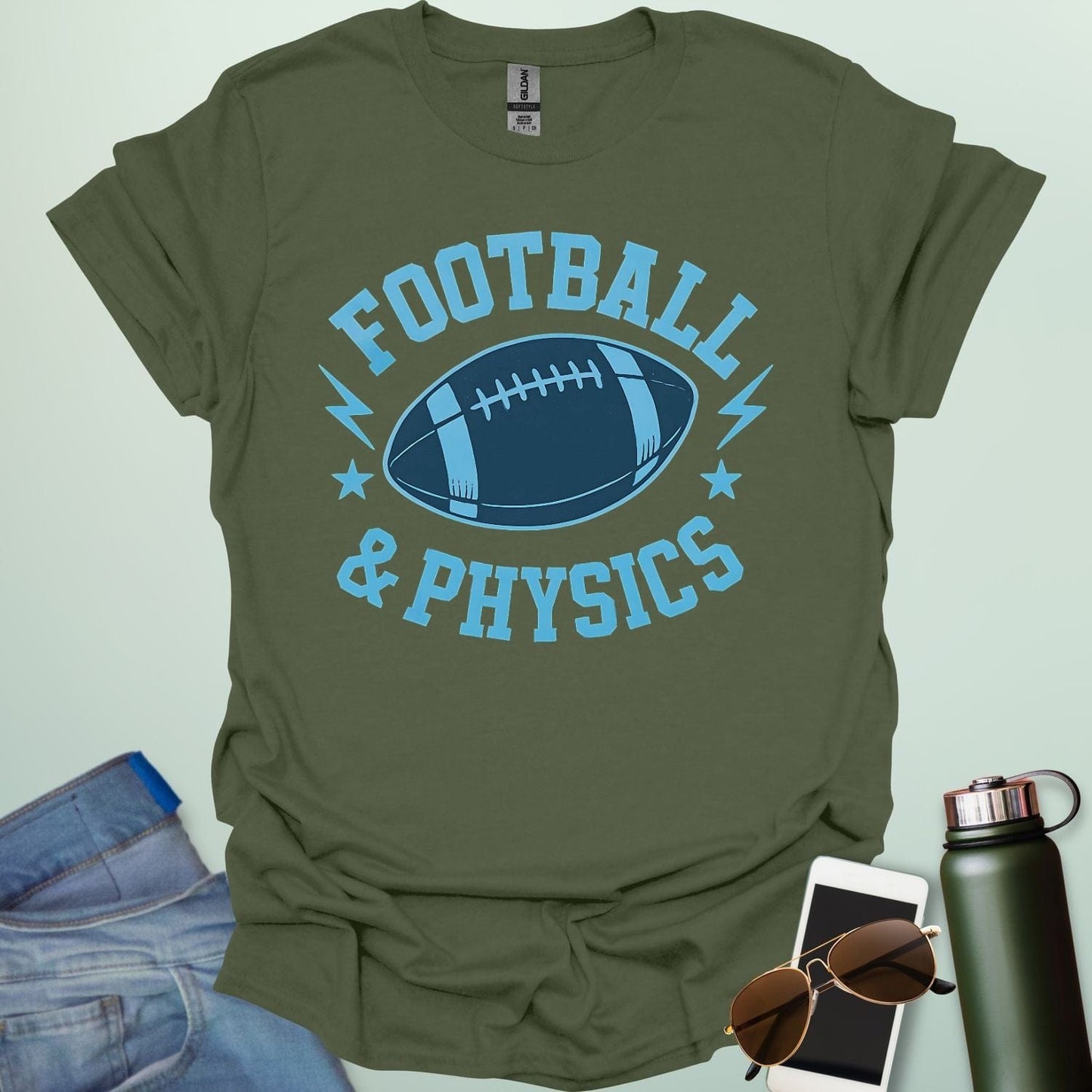 A military green t-shirt with a dynamic illustration of a football surrounded by lightning bolts and stars, with the text 'FOOTBALL & PHYSICS.'