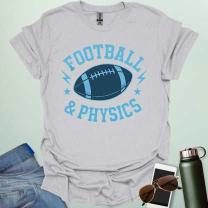 A ice grey t-shirt with a dynamic illustration of a football surrounded by lightning bolts and stars, with the text 'FOOTBALL & PHYSICS.'