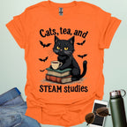 Cats, Tea, and STEAM Studies t-shirt with black cat, books, tea cup, and bats — a cozy geeky design for STEM/STEAM fans and book lovers.