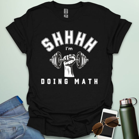 Shhhh… I’m Doing Math t-shirt featuring a retro-style weight plate graphic (45, 15, 20) with distressed text—funny gym-math mashup for fitness and math fans.