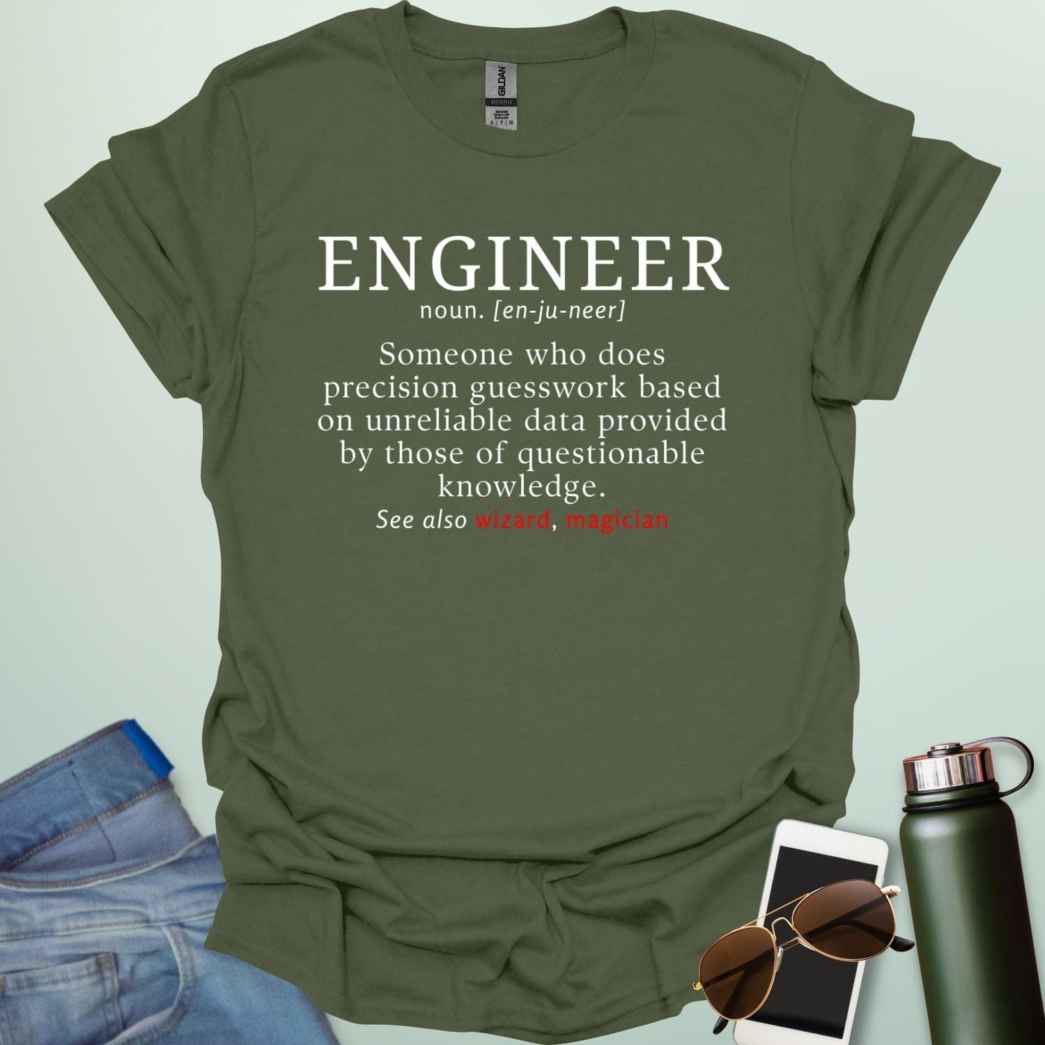Engineer' t-shirt with a humorous dictionary-style definition and 'See also wizard, magician' in red.