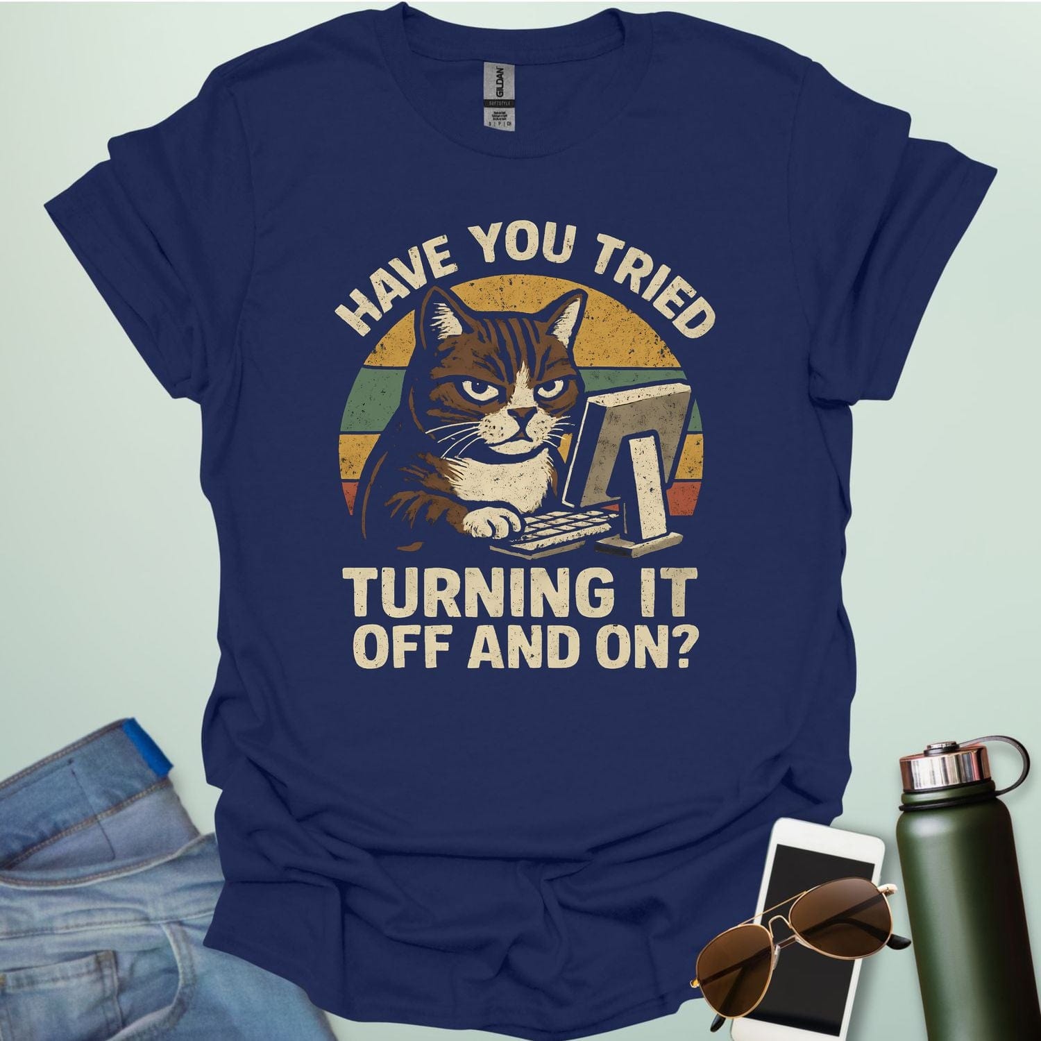 Funny 'Have You Tried Turning It Off and On' t-shirt with a retro-style cat at a computer.