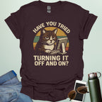 Funny 'Have You Tried Turning It Off and On' t-shirt with a retro-style cat at a computer.