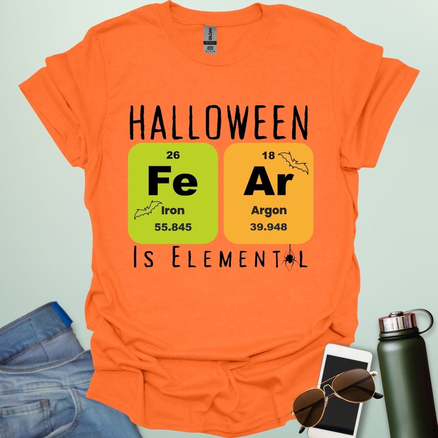 Fear Is Elemental t-shirt with periodic-table / chemistry element graphics — a Halloween science pun design for STEM fans.
