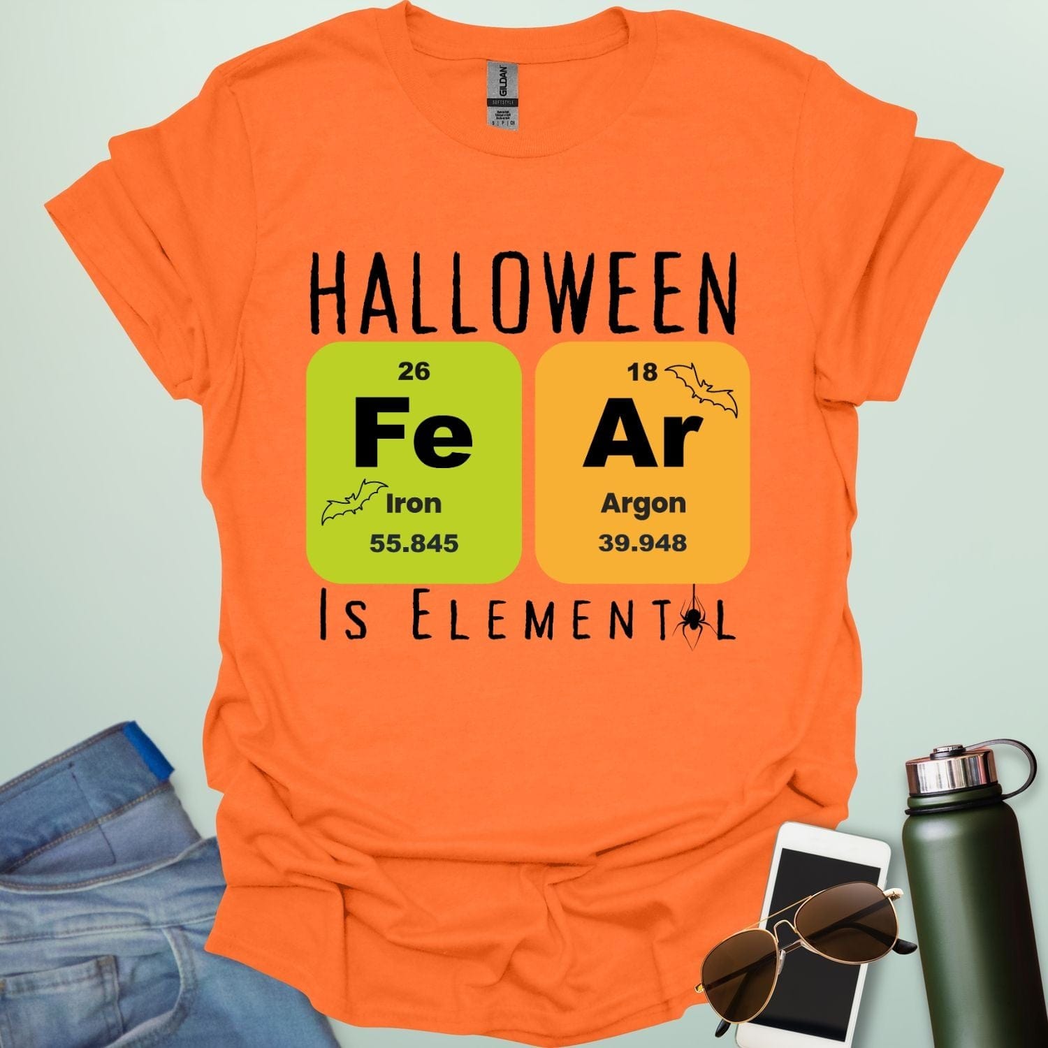 Fear Is Elemental t-shirt with periodic-table / chemistry element graphics — a Halloween science pun design for STEM fans.