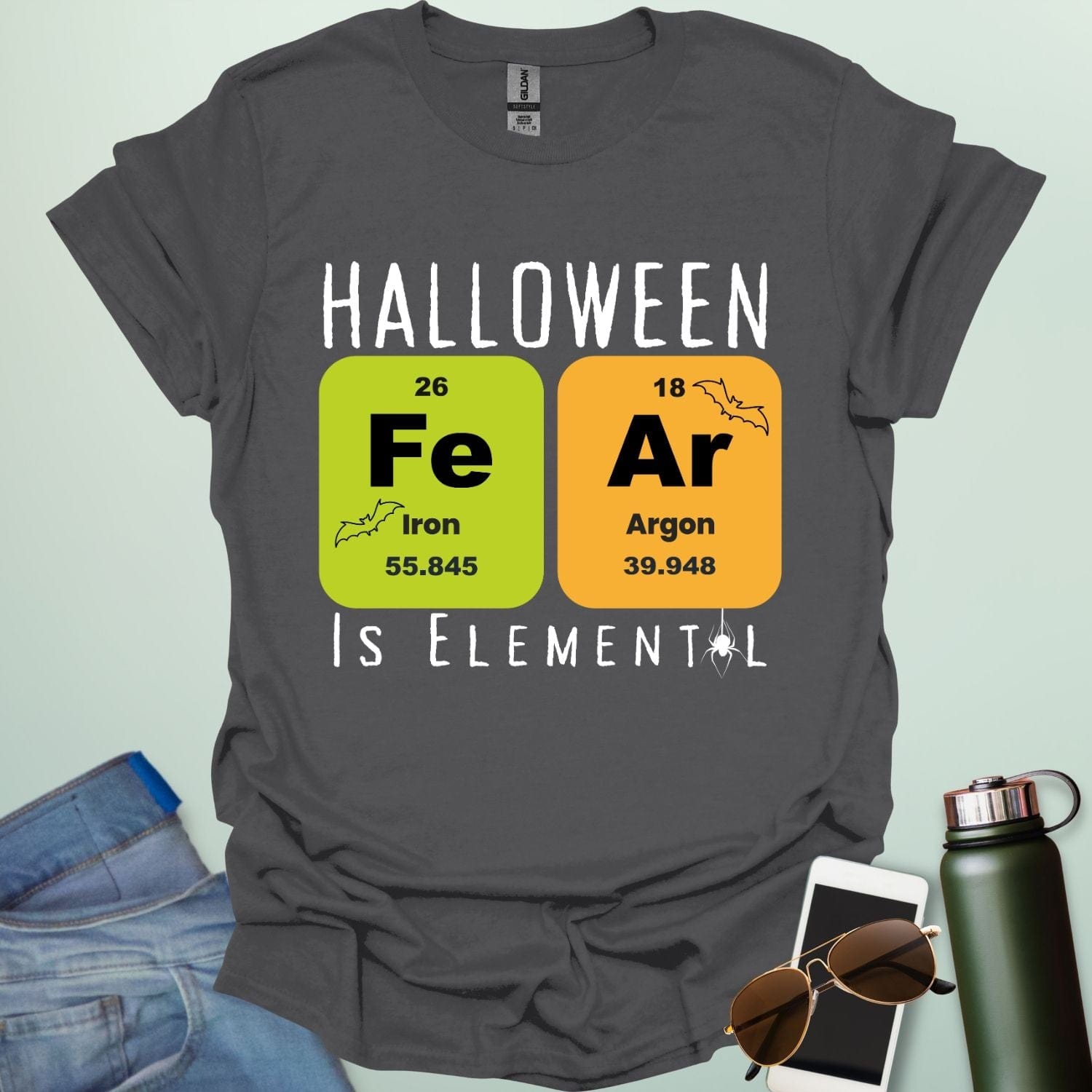 Fear Is Elemental t-shirt with periodic-table / chemistry element graphics — a Halloween science pun design for STEM fans.