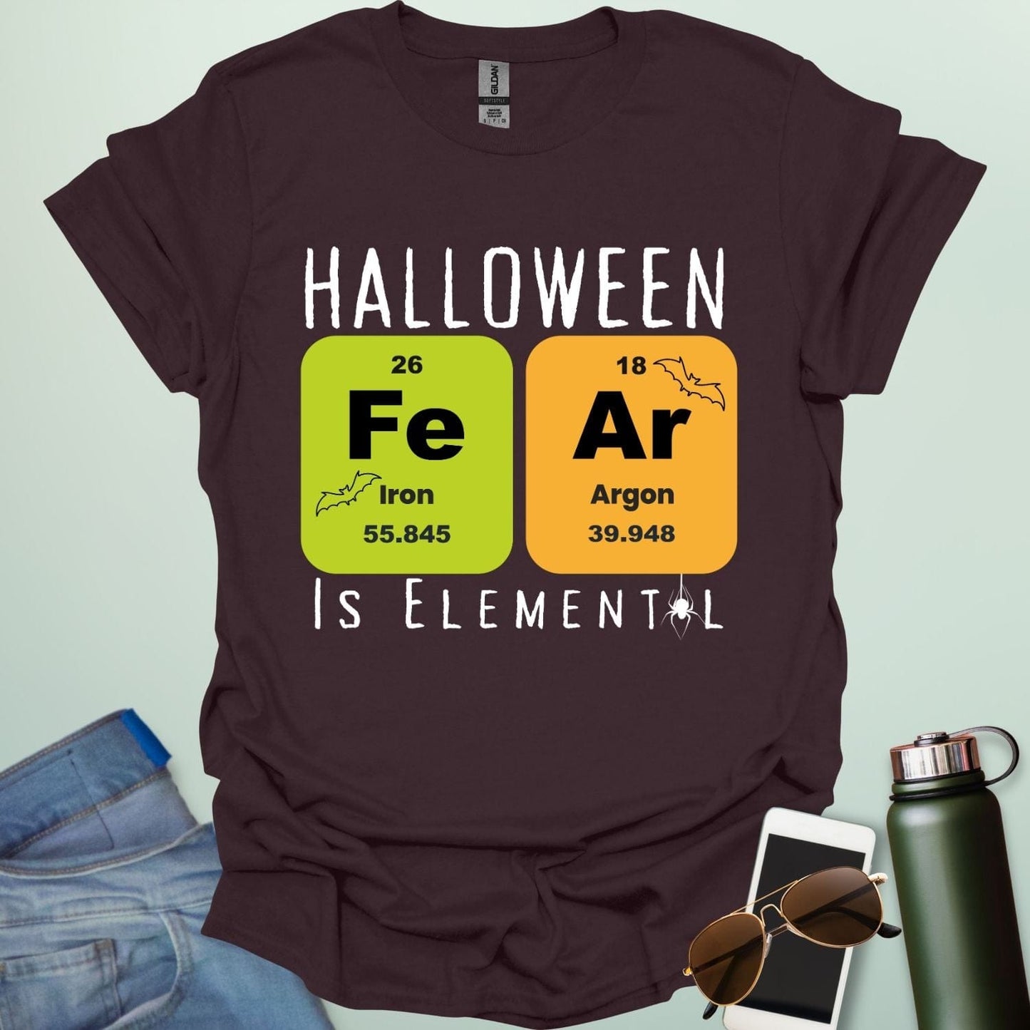 Fear Is Elemental t-shirt with periodic-table / chemistry element graphics — a Halloween science pun design for STEM fans.