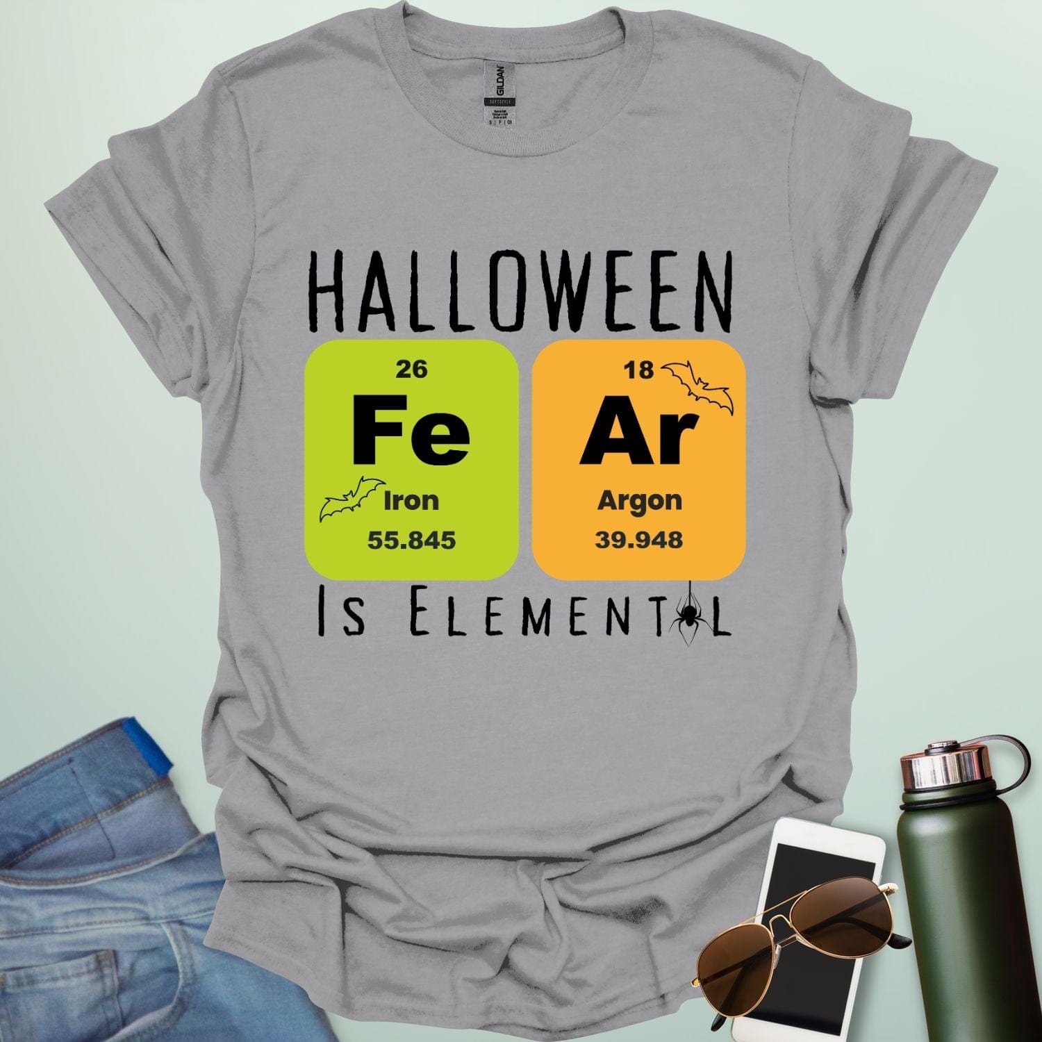 Fear Is Elemental t-shirt with periodic-table / chemistry element graphics — a Halloween science pun design for STEM fans.