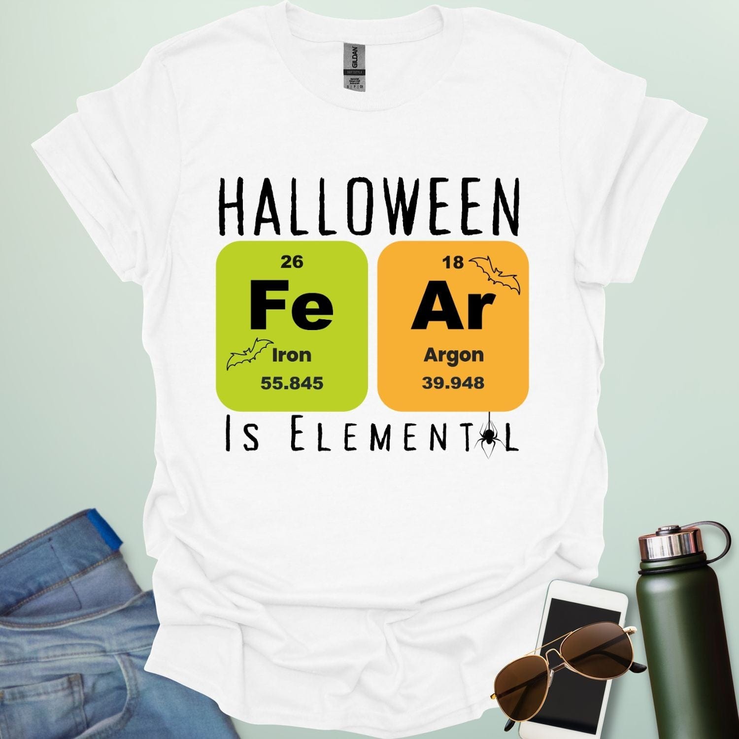 Fear Is Elemental t-shirt with periodic-table / chemistry element graphics — a Halloween science pun design for STEM fans.